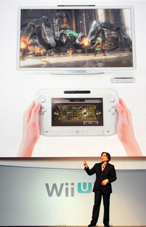 In this photo provided by Nintendo of America, Satoru Iwata, president and ceo of Nintendo, shares details about 'Wii U', a new console launching in 2012 that includes a controller with a 6.2-inch screen, during the company's presentation on the opening day of the 2011 Electronic Entertainment Expo (E3), June 7, 2011 in Los Angeles. The E3 is the video game industry's premier trade show. (Photo by Nintendo of America, Bob Riha, Jr.) No Sales